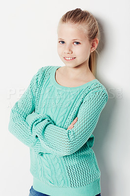 Buy stock photo Child, portrait and fashion pride in studio, cool and confidence by white background. Female person, girl and casual clothing or style by backdrop, kid and trendy winter sweater or smiling face