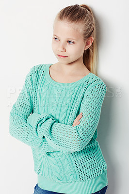 Buy stock photo Child, relaxing and fashion pride in studio, cool and confidence by white background. Female person, girl and casual clothing or style by backdrop, kid and trendy winter sweater or arms crossed
