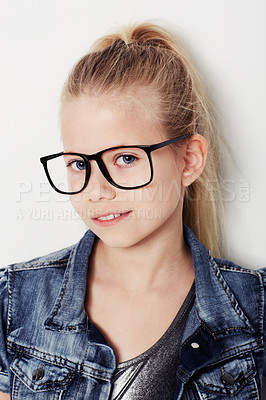 Buy stock photo Child, portrait and cool fashion glasses in studio, frame and confident by white background. Female person, girl and casual clothing or style by backdrop, kid and denim jacket pride for eyesight test