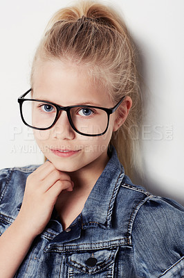 Buy stock photo Child, portrait and fashion glasses in studio, cool and confidence by white background. Female person, girl and casual clothing or style by backdrop, kid and denim jacket pride for eyesight test