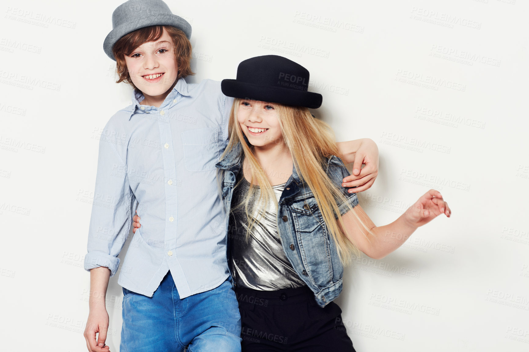Buy stock photo Fashion, kids or happy with a brother and sister in studio isolated on a white background for contemporary style. Smile, hat and children with best friends posing in fashionable or stylish clothes
