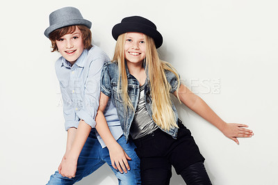 Buy stock photo Shot of two playful kids in a studio