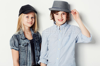 Buy stock photo Portrait of two fashionable young kids posing in the studio