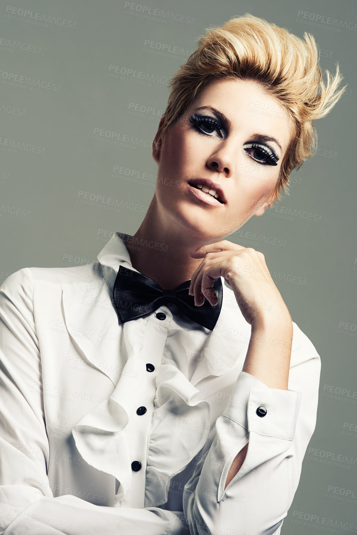 Buy stock photo Makeup, bow tie or portrait of fashion model with vintage clothes or classy aesthetic in studio. Confidence, edgy woman or cool girl with retro style, elegance and beauty isolated on grey background