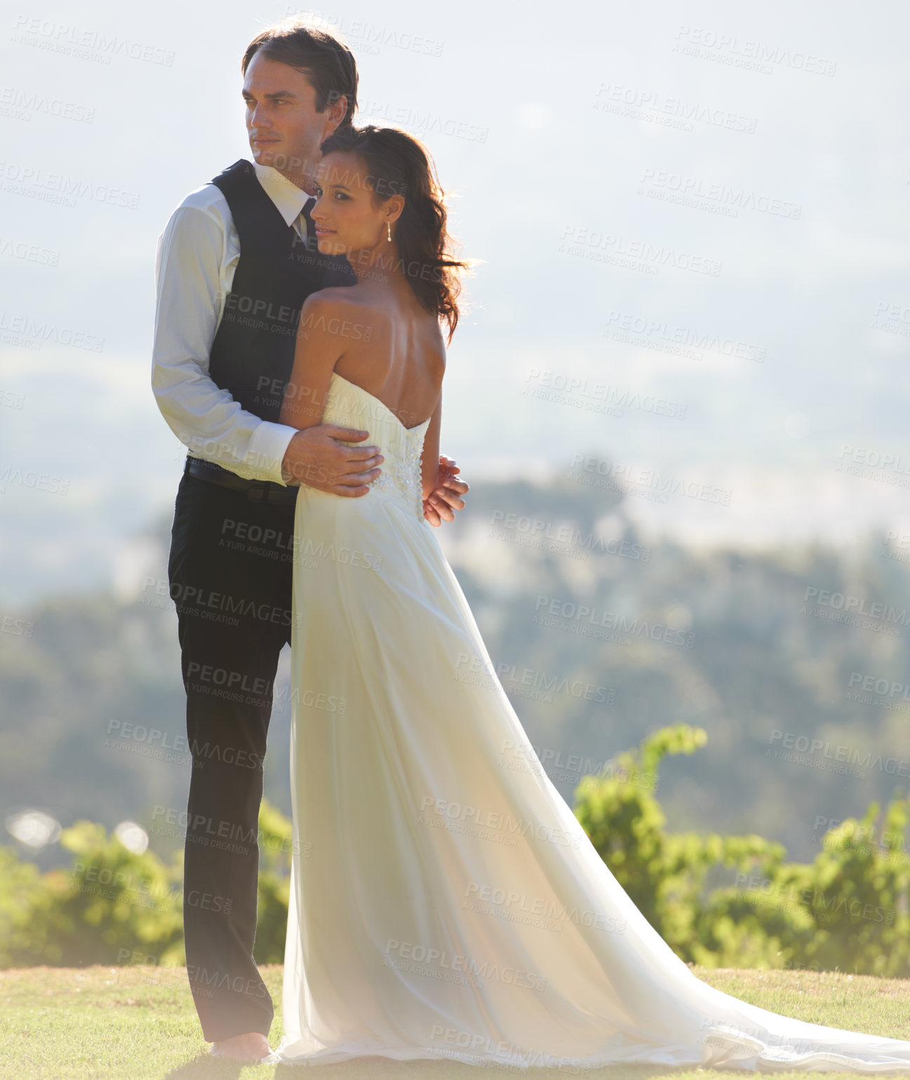 Buy stock photo A groom embracing his new wife