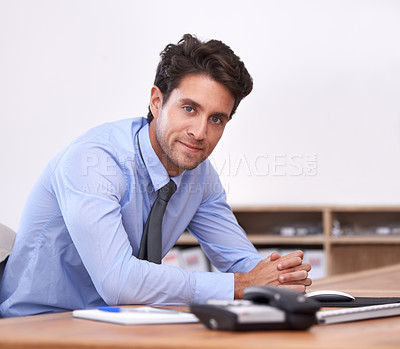 Buy stock photo Businessman, portrait and confident professional in office, relaxing and career pride in workplace. Male person, face and startup or entrepreneur, positive and planning for future company at desk