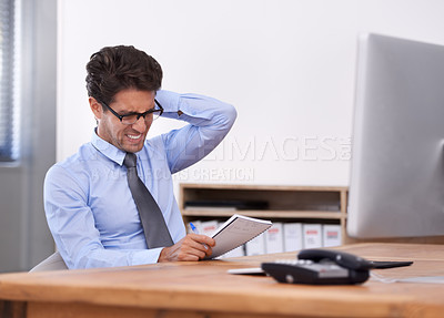Buy stock photo Business man, stress and writing in notebook, contemplating ideas and notes in workplace. Male professional, frustrated and planning for schedule or strategy, mental health and journal or info