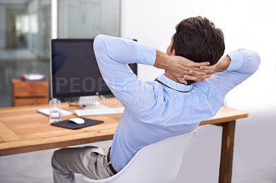 Buy stock photo Back, relax or happy man in office on break for mental health, pride or wellness at his desk or workplace. Calm, business or employee sleeping with peace or hand behind his head stretching or resting