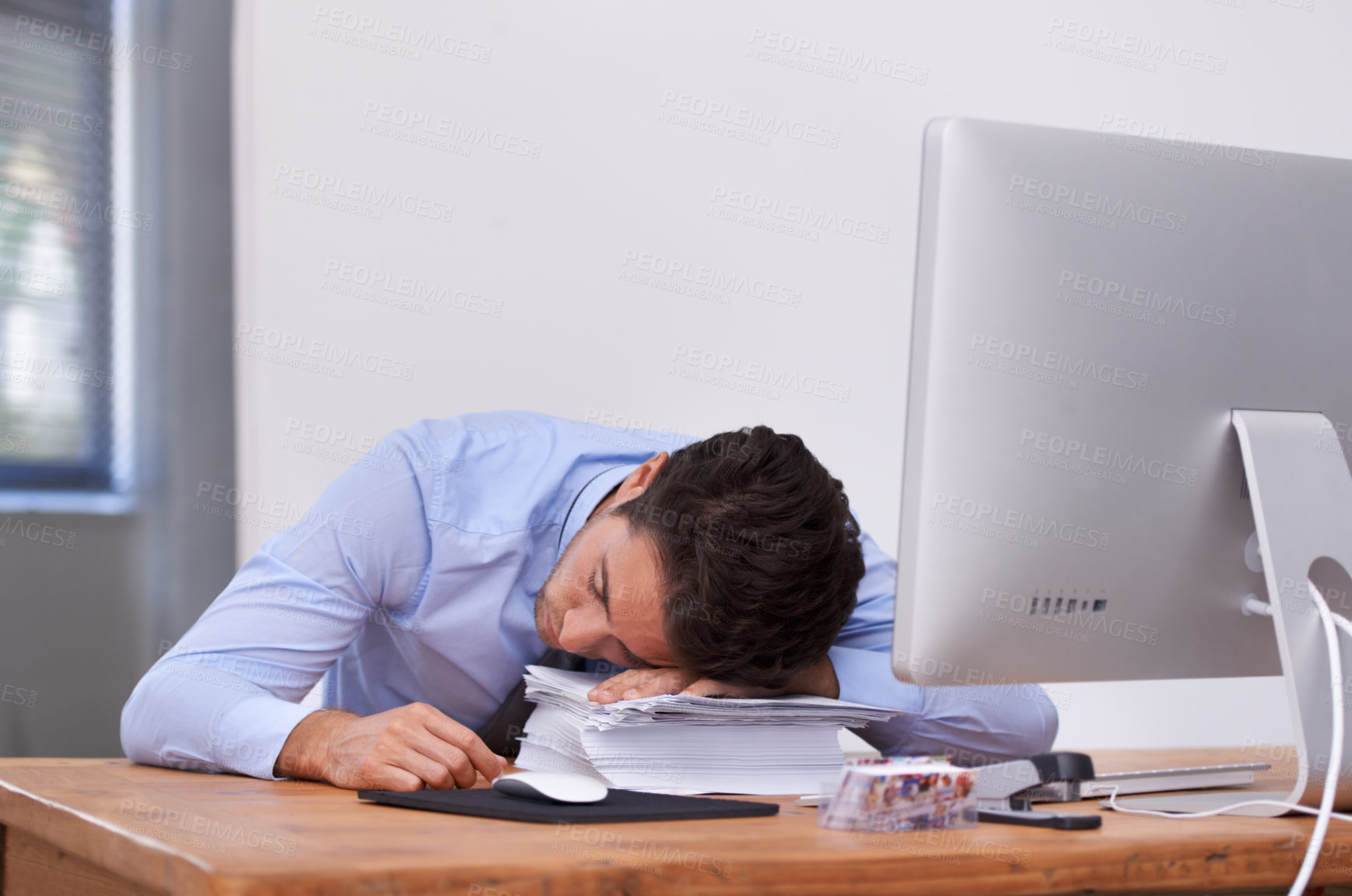 Buy stock photo Business man, sleeping and burnout or tired at desk, professional and dreaming in workplace. Businessperson, nap and exhausted in office or resting, mental health and stress for paperwork or lazy