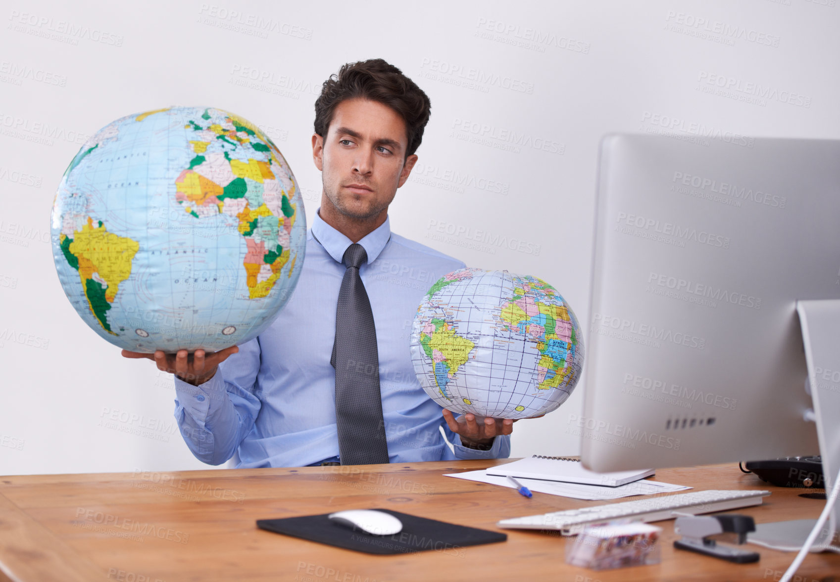 Buy stock photo Travel, choice or businessman with globe, earth or worldwide destination for trip in office. Agent, computer or professional person with map of planet for geography, vacation or international journey