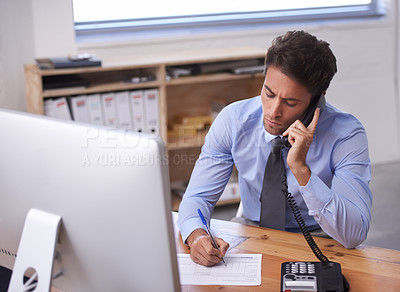 Buy stock photo Cropped shot of a handsome young businessman using the phone