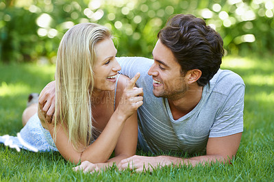 Buy stock photo Couple, relax on grass in park with smile, love and commitment in healthy relationship. People on a date outdoor, happiness and care with trust, partner and bonding together for marriage and romance