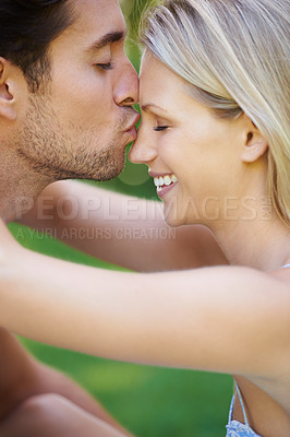 Buy stock photo Happy couple, man kiss woman with love, commitment and care outdoor, Valentines day and healthy relationship. Loyalty, respect and trust with partner, people are bonding with affection and connection