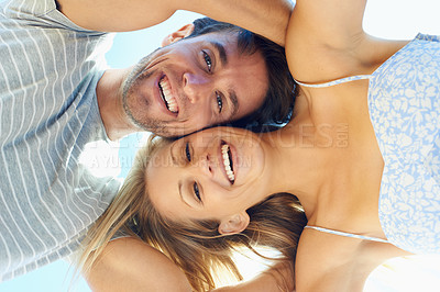 Buy stock photo Laughing, portrait or happy couple hug on outdoor date for support, joy or love in nature together. Low angle, romantic man or funny woman with smile on holiday vacation for bond, travel or wellness