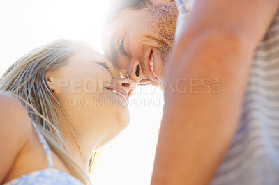 Buy stock photo Forehead, eye contact or happy couple hug in outdoor on date for support or love in nature together. Low angle, romantic man or woman with smile on holiday vacation for fun bond, travel or wellness 