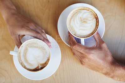 Buy stock photo Top view, hands or couple in cafe with a coffee to relax with care, morning espresso or support. Closeup, date or people with tea, cappuccino or romance with love, peace or cup of tea in restaurant