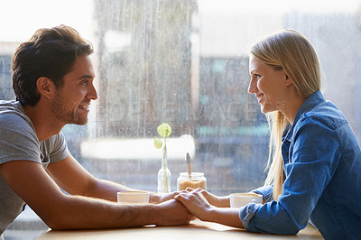 Buy stock photo Holding hands, cafe or happy couple on date talking or speaking of anniversary or holiday vacation. Tea drink, woman or romantic man in conversation for care, love or support to relax in coffee shop
