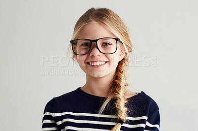 Buy stock photo Portrait of a cute girl giving you a toothy smile while wearing hipster glasses