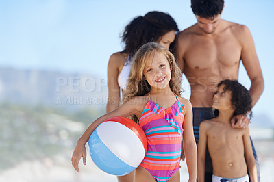 Buy stock photo Happy child, portrait and beach ball with family for fun summer, weekend or outdoor holiday together. Little girl smile with mother, father and sibling for vacation on ocean coast or sea in nature