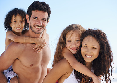 Buy stock photo Happy family, portrait and piggyback for bonding, vacation or outdoor holiday weekend together. Father, mother and children smile for hug, love or back ride on summer break by ocean coast in nature
