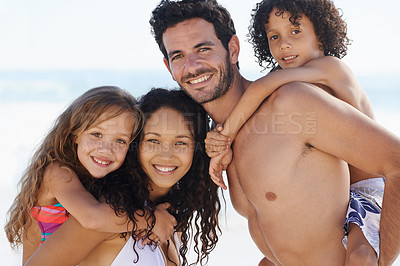 Buy stock photo Happy family, portrait and hug for bonding, vacation or outdoor holiday weekend together. Father, mother and children smile for piggyback, love or back ride on summer break by ocean coast in nature