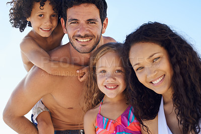 Buy stock photo Happy family, portrait and beach for vacation, outdoor holiday weekend or bonding together. Face of father, mother and children smile for love, hug or piggyback for summer break by ocean in nature