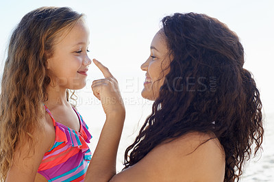 Buy stock photo Happy mother, girl and poking nose at beach for love, care or support for child or daughter in nature. Mom and cute young kid smile for touch, sense or sunscreen at ocean or outdoor sea by the coast