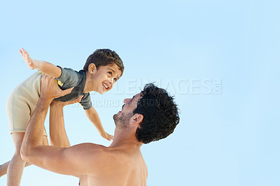 Buy stock photo Happy father, beach and lifting boy in bonding, vacation or outdoor holiday weekend together. Dad, child or kid smile for love, support or fun summer break by ocean with blue sky background on mockup