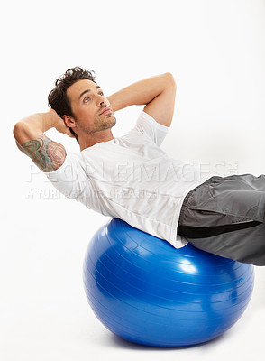 Buy stock photo Ball, sit ups or man in studio training abdominal muscles for strong stomach in exercise for fitness. Abs, white background or healthy sports athlete in calisthenics for core, fitness or body workout