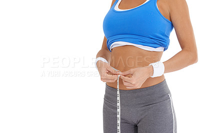 Buy stock photo Woman, stomach and measure tape for diet, weight loss and health results or fitness progress in studio. Model hands check body or abdomen for exercise goals, training or workout on a white background