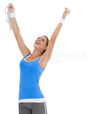 Buy stock photo Healthy young woman expressing triumph while holding a tape measure and isolated on white