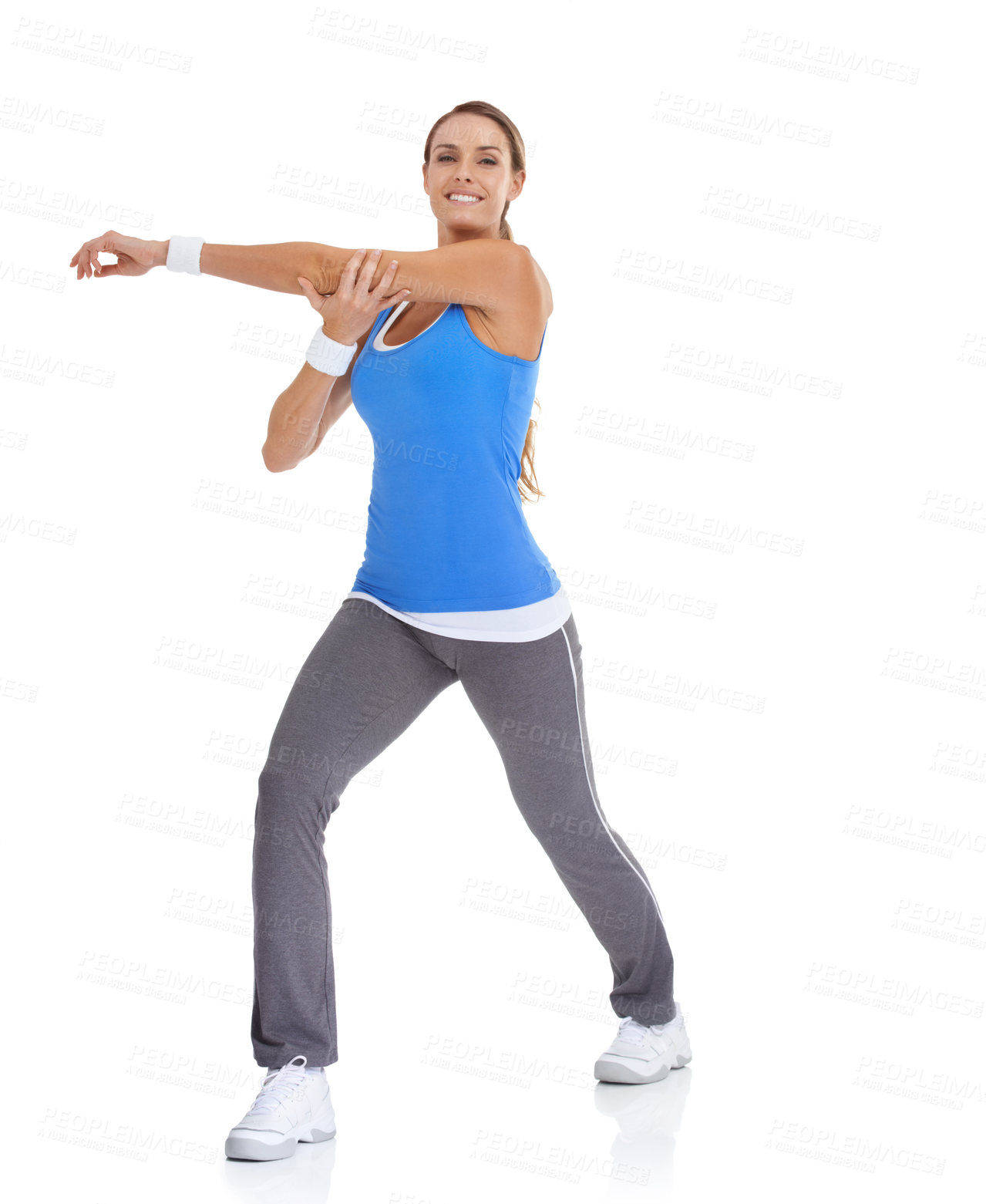 Buy stock photo Fitness, portrait and woman stretching in studio for arm exercise, training or workout. Sports, health and young female person with muscle warm up for wellness activity isolated by white background.