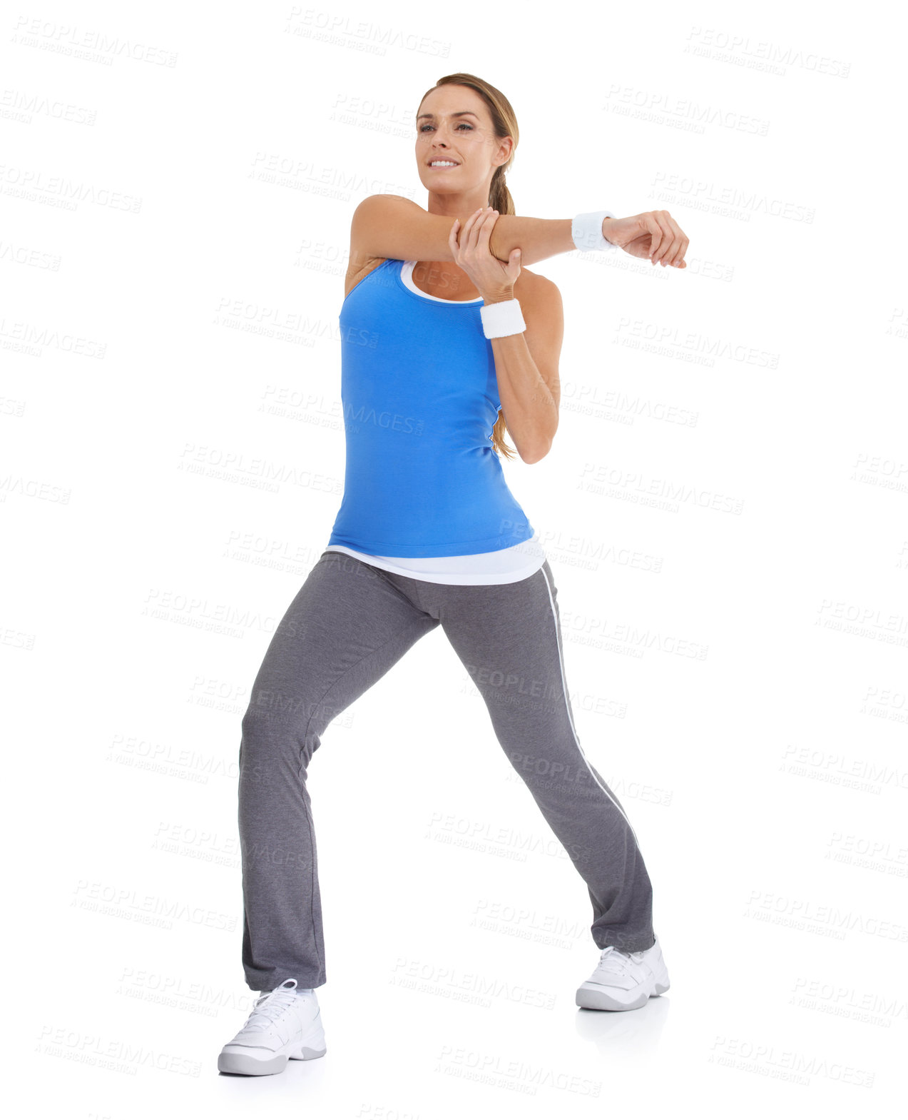 Buy stock photo Sports, health and woman stretching in studio for arm exercise, training or workout. Fitness, smile and young female person with muscle warm up for wellness activity isolated by white background.