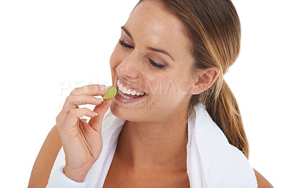 Buy stock photo Wellness, grape and young woman in a studio for weight loss fitness exercise or healthy diet. Sports, self care and female person eating fruit for diet food nutrition isolated by white background.