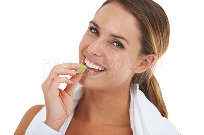 Buy stock photo Diet, grape and portrait of woman in a studio for fitness exercise and healthy snack. Wellness, nutrition and young female person eating organic and fresh fruit isolated by white background.