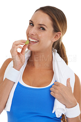 Buy stock photo Health, grape and portrait of woman in a studio for weight loss, fitness exercise or wellness diet. Sports, self care and young female person eating fruit for nutrition isolated by white background.