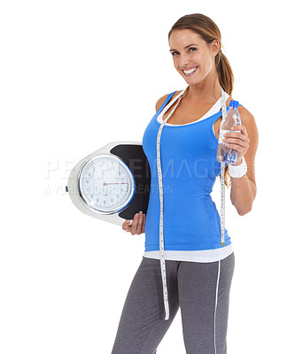 Buy stock photo Woman, water bottle and scale in studio for health, diet and exercise, fitness or wellness results on a white background. Portrait of sports model with measure tape and liquid for training progress