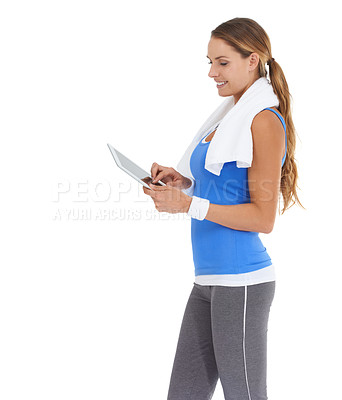 Buy stock photo Young woman in sportswear using a tablet while isolated on white