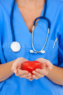 Buy stock photo Heart, hands and cardiology nurse for healthcare, person with charity and support on white background. Cardiovascular health, trust and kindness with love, medical professional in studio and care