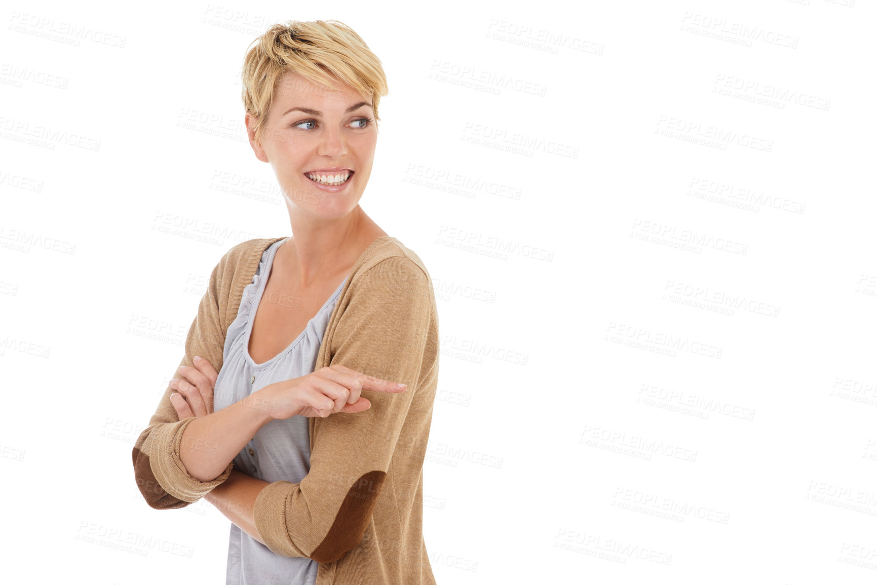 Buy stock photo A pretty young woman pointing towards copyspace while isolated on a white background