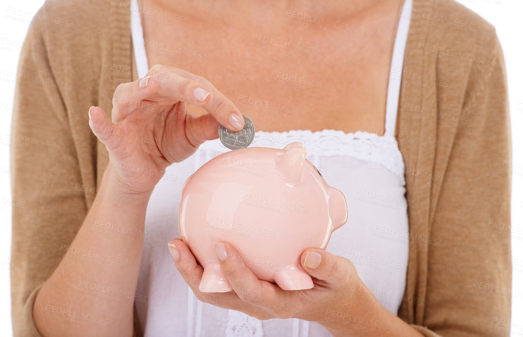 Buy stock photo Woman, hands and coin in piggy bank for savings, investment or financial growth on a white studio background. Closeup of female person with money container for finance, budget or safe cash and profit