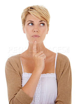 Buy stock photo Studio shot of an attractive woman looking thoughtful against a white background