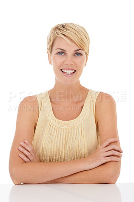 Buy stock photo A gorgeous young woman sitting and crossing her arms while isolated on white