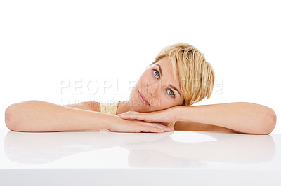 Buy stock photo Calm woman, portrait and relax on table with natural beauty isolated on a white studio background. Face of young female person, model or blonde resting head on hands in confidence on mockup space