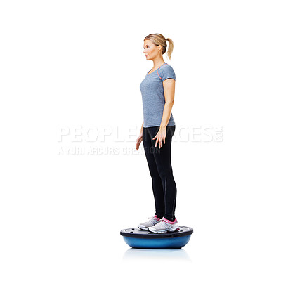 Buy stock photo Woman, ball and fitness for balance, exercise or workout on a white studio background. Young active female person or athlete standing on half round object for health and wellness on mockup space