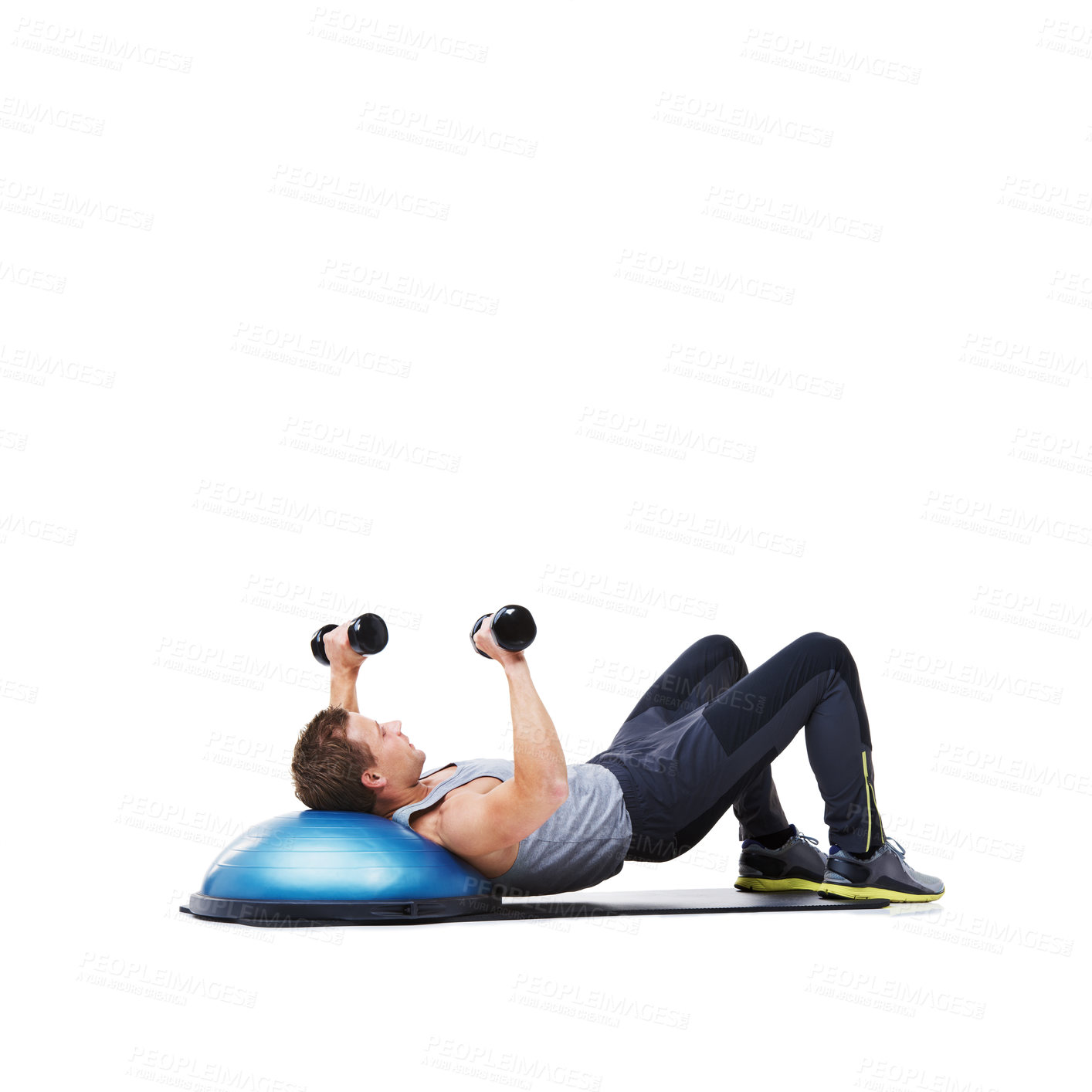 Buy stock photo Man, lying and half ball with dumbbells for workout, exercise or weightlifting on a white studio background. Active young male person with weights in core training, gym or fitness on mockup space