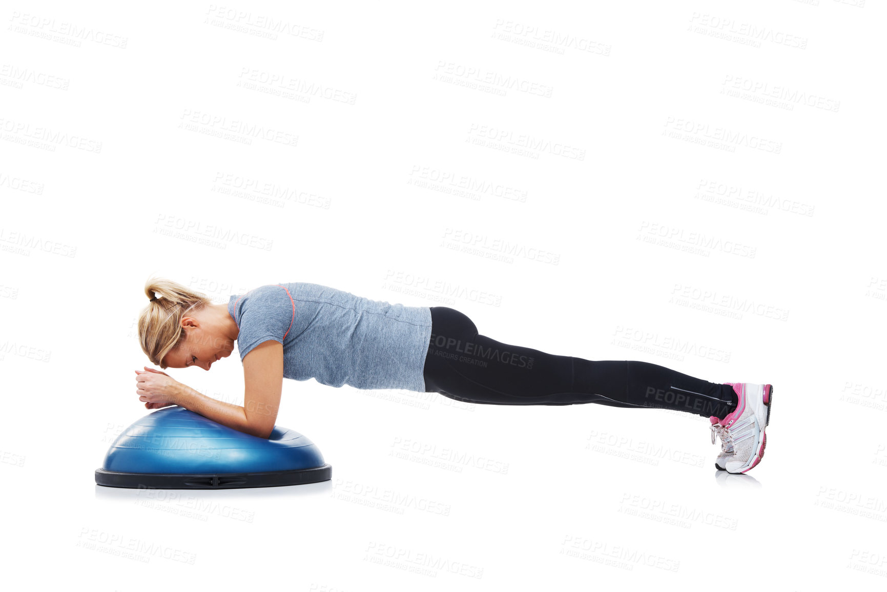Buy stock photo A young woman working her upper body using a bosu-ball