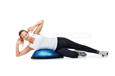 Buy stock photo Woman, bosu ball and lying in fitness, balance or exercise on a white studio background. Young active female person or athlete on half round object in training, health and wellness on mockup space