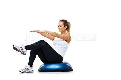 Buy stock photo A young woman sitting on a bosu-ball while exercising