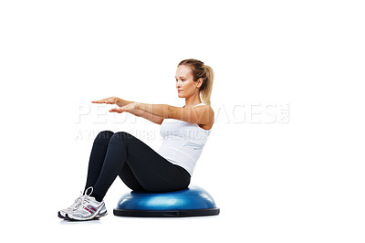 Buy stock photo Sports, half ball and young woman in a studio for stretching body workout or training with balance. Sports, equipment and female person with muscle warm up exercise isolated by white background.
